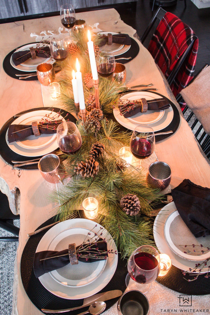 Combine rustic natural elements and a little Christmas glam to create this sleek Rustic Chic Christmas Table with black and white dishes and pops of greens.