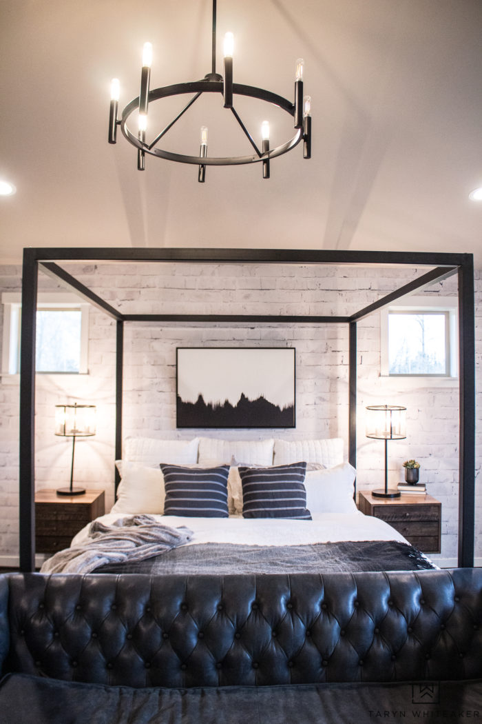 Take a tour of this rustic modern black and white master bedroom filled with wood beams, tons of texture and clean lines!