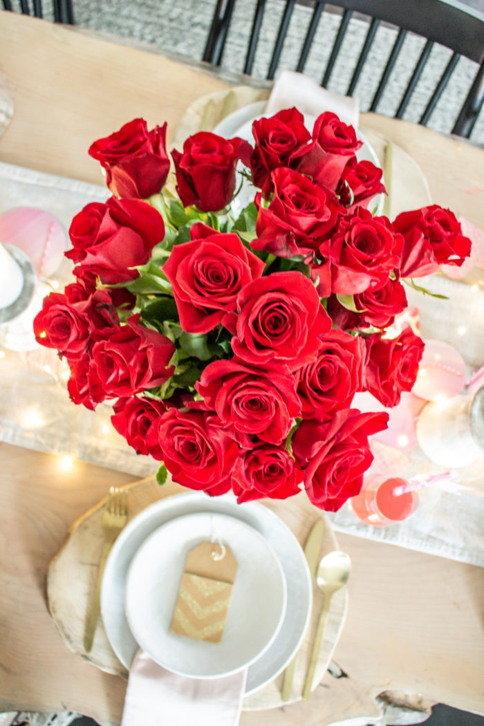 Bouquet of red roses as table centerpiece, so classic and gorgeous. 