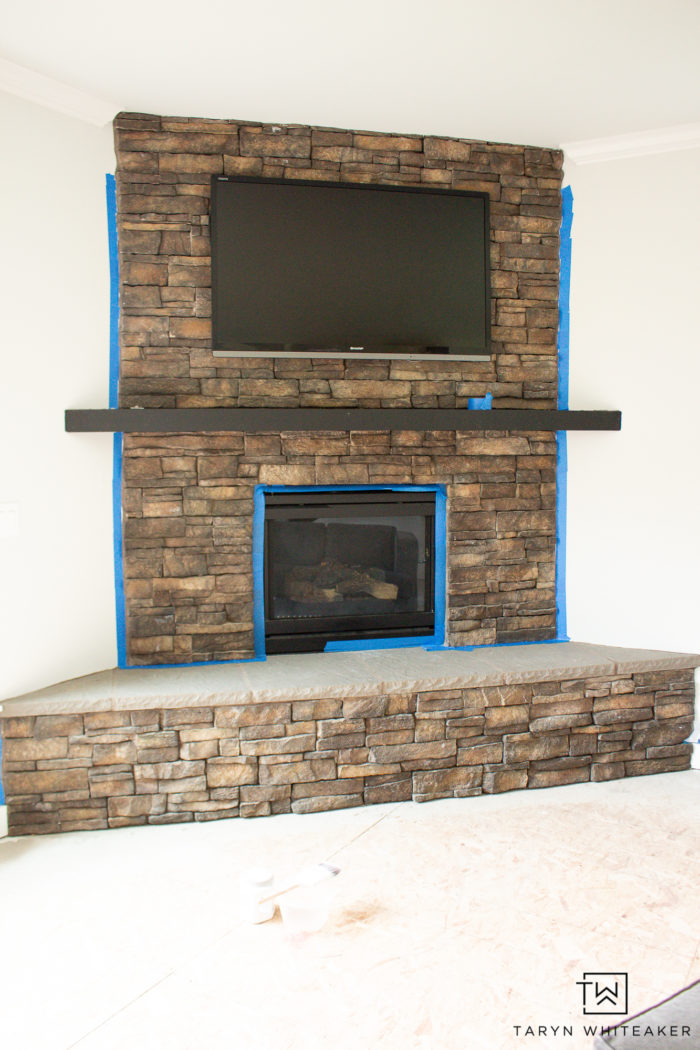 whitewash stone fireplace before and after