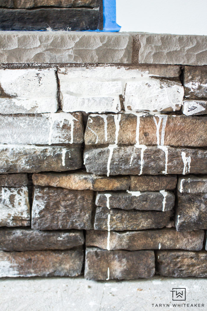 whitewash stone fireplace before and after