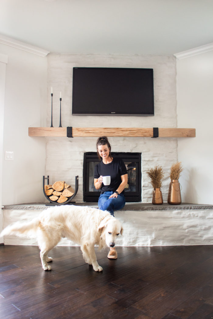 Take your dark stone fireplace and turn it into something more modern and chic with this stone fireplace makeover on a budget!