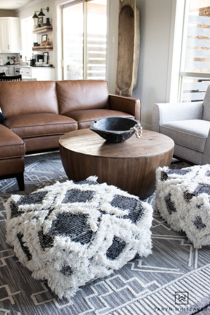 Check out this neutral living room filled with a Organic Modern Furniture and tons of texture! Love the cognac sectional and natural look.