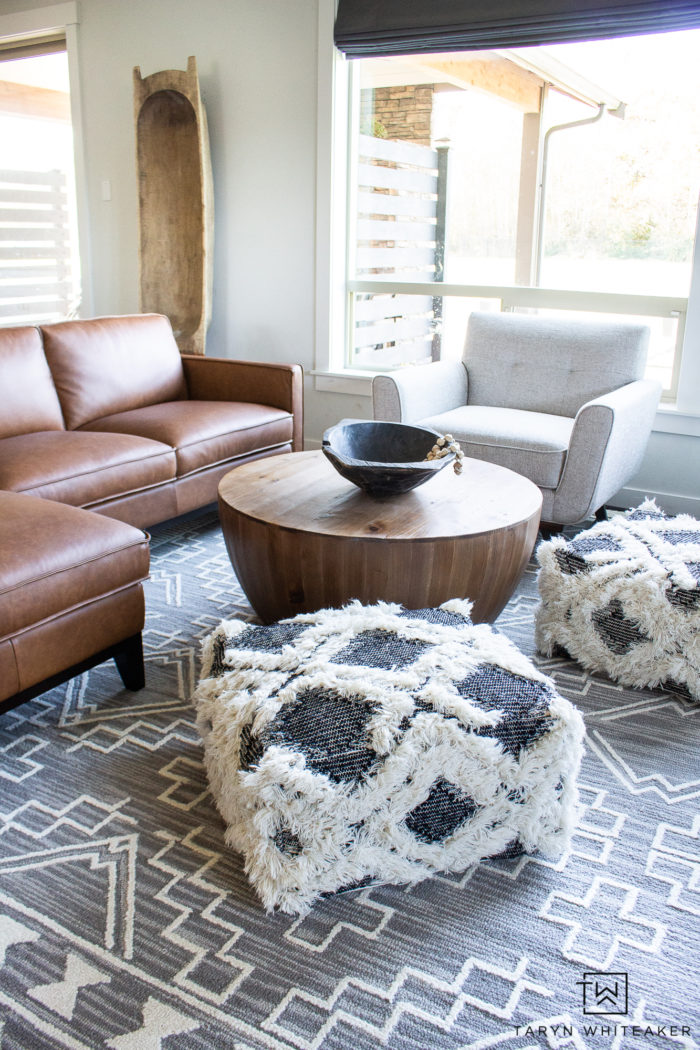 Check out this neutral living room filled with a Organic Modern Furniture and tons of texture! Love the cognac sectional and natural look.