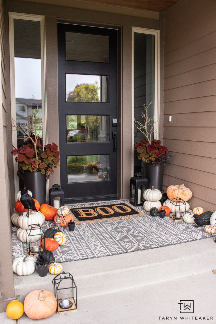 Transition your fall porch with some Halloween Porch Decor by adding black crows, lanterns, braches and boo door mat! 