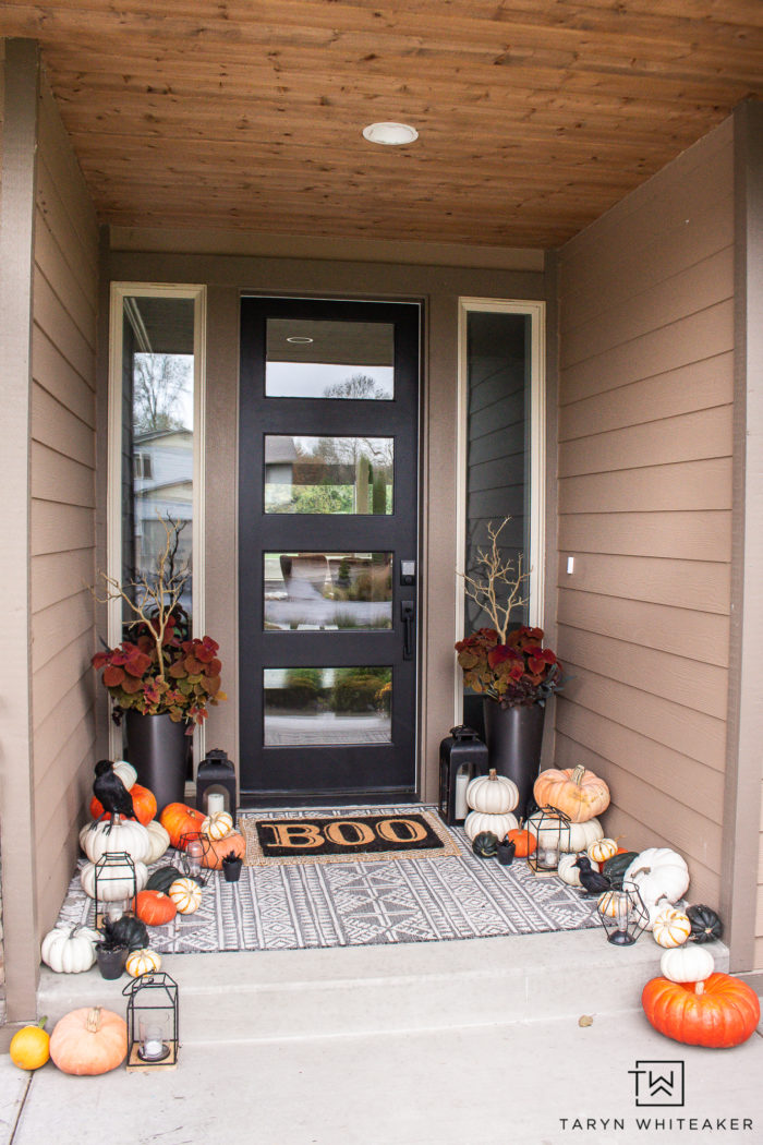 Transition your fall porch with some Halloween Porch Decor by adding black crows, lanterns, braches and boo door mat! 