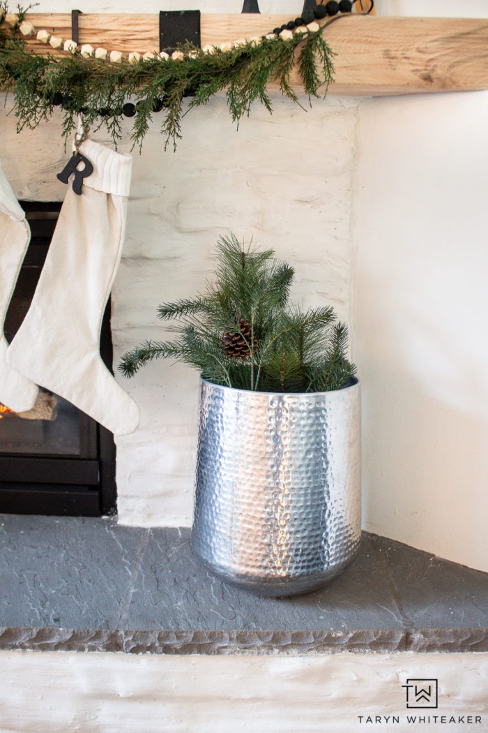 An Asymmetrical Garland Mantel is the perfect way to decorate your mantel for Christmas. It's simple, modern and festive 