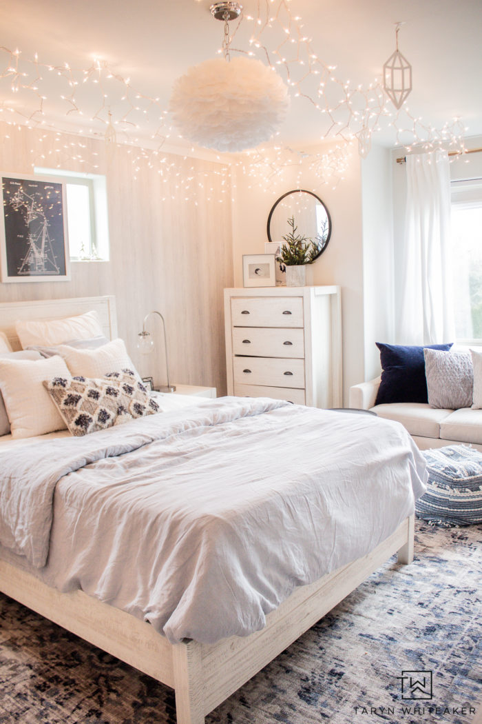 Check out this Winter Wonderland Bedroom with bright white and baby blue with tons of hanging icicle lights! Perfect for a winter bedroom. 