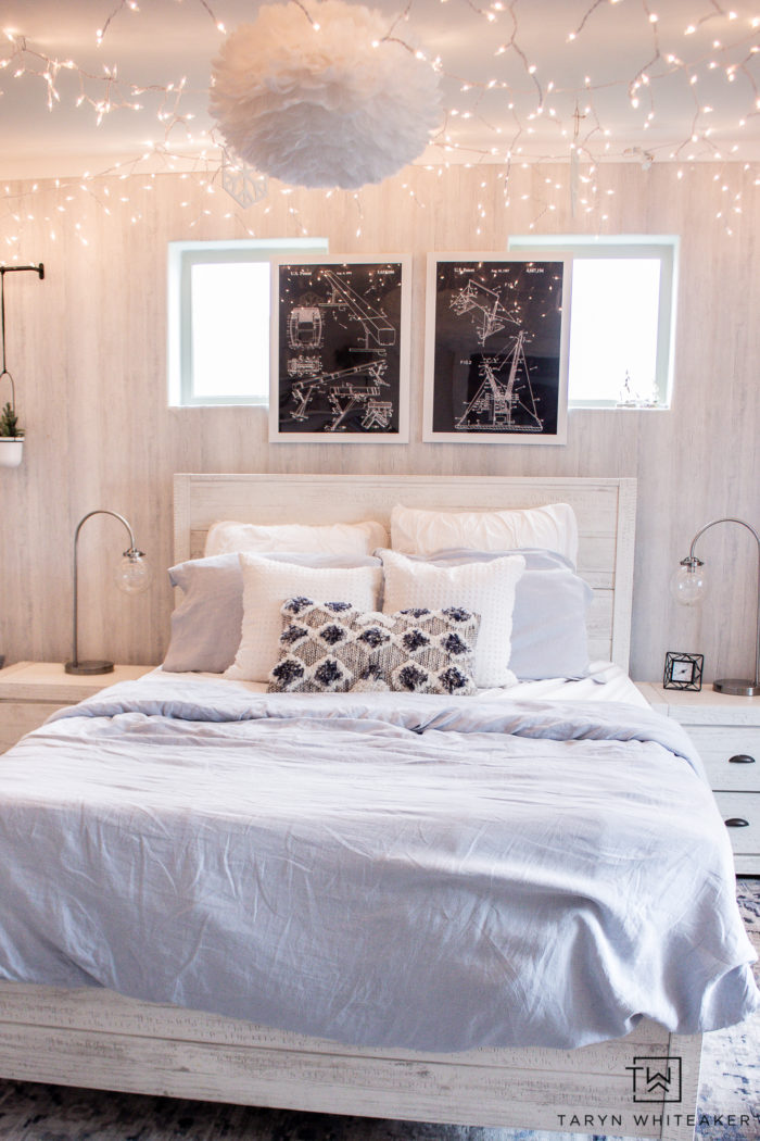Check out this Winter Wonderland Bedroom with bright white and baby blue with tons of hanging icicle lights! Perfect for a winter bedroom. 