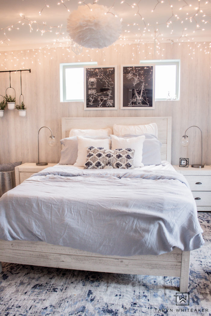 Check out this Winter Wonderland Bedroom with bright white and baby blue with tons of hanging icicle lights! Perfect for a winter bedroom. 