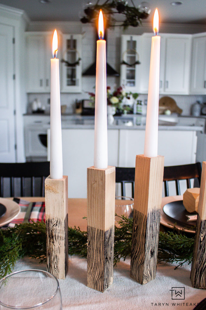 Learn how to make your own Wooden Taper Candle Holders with embossed faux woodgrain pattern! Perfect rustic Christmas decor.