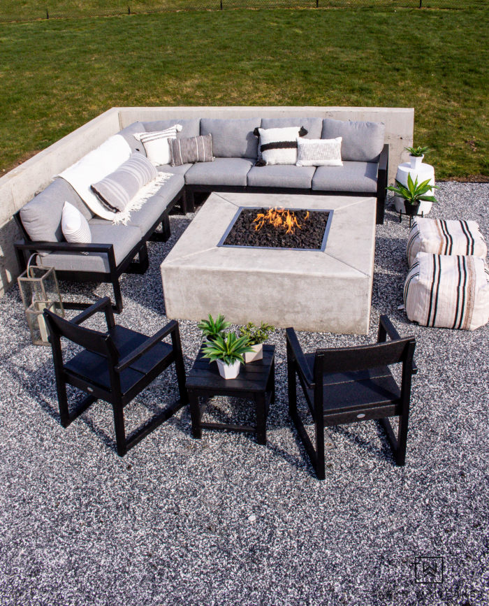 Tour this modern outdoor fire pit seating area with gorgeous Polywood outdoor furniture and neutral tones. 