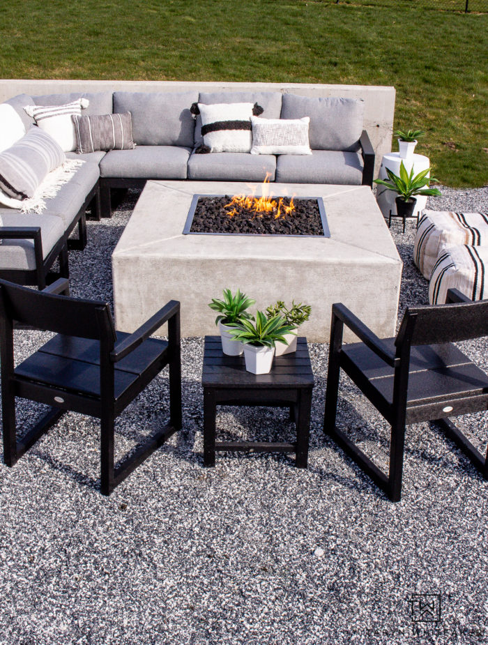 Tour this modern outdoor fire pit seating area with gorgeous Polywood outdoor furniture and neutral tones. 