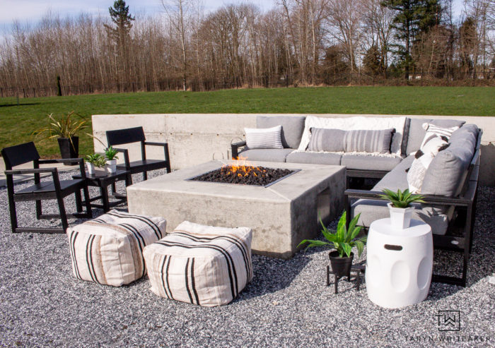 Modern outdoor fire pit with concrete square fire pit and comfy sectional. 