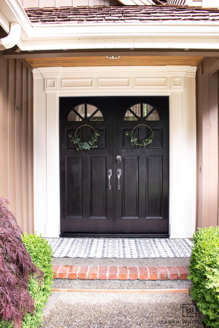 Modern cottage front door with simple front door decor. 