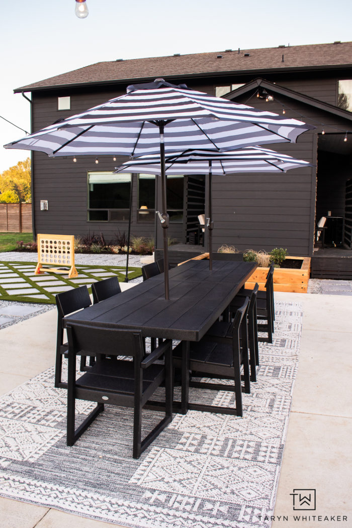 Modern Outdoor black and white Dining Space using two Polywood EDGE Dining Tables to create a large 12 person outdoor dining table. 