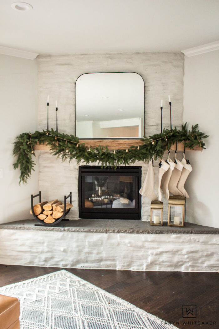 This Neutral Christmas Mantel With Green Garland has a classic, timeless yet subtle modern look to Christmas decor. 