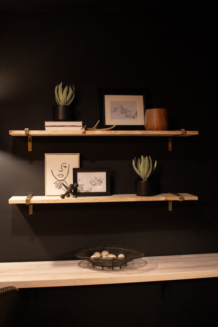 Modern mid century modern open shelving with brass brackets. 