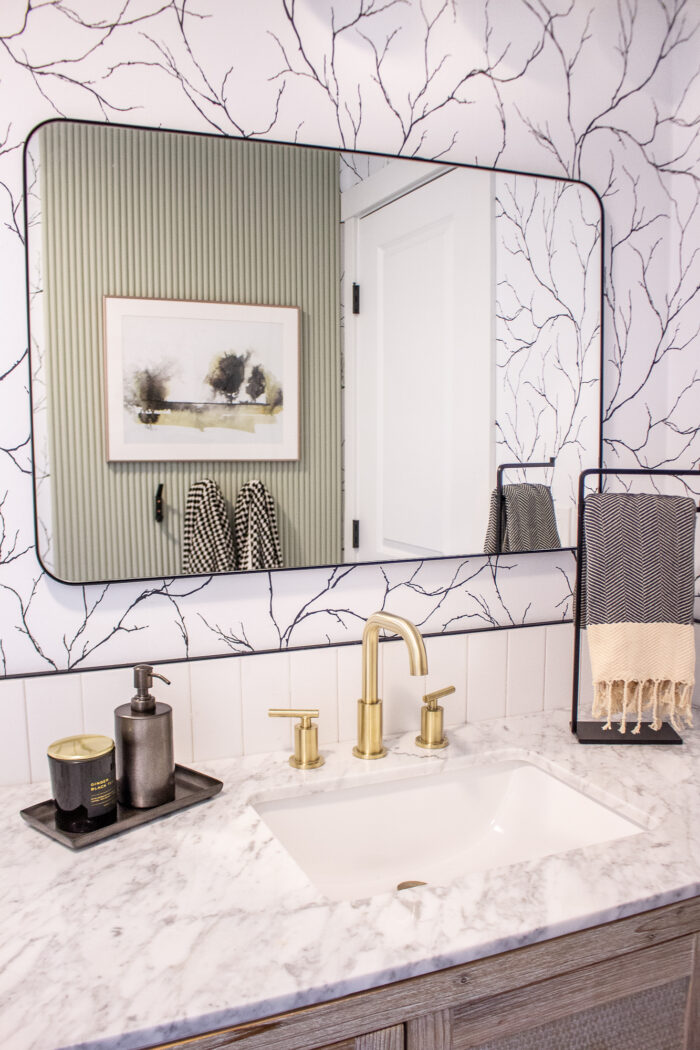 black and white bathroom design with fluted accent wall 