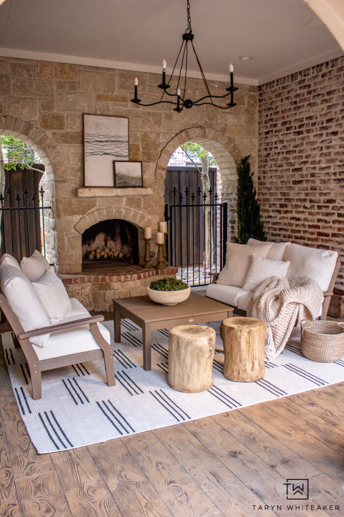 Transitional Modern outdoor space with two love seats and coffee table nestled by the outdoor fire. 