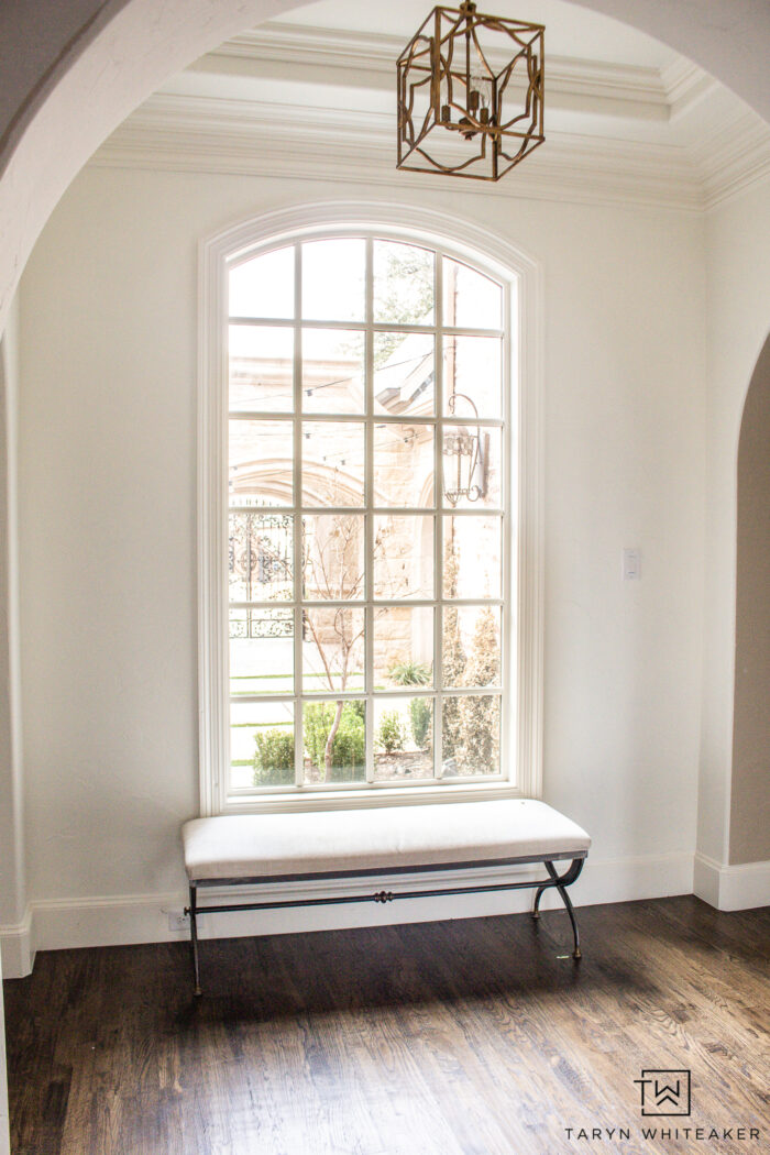 Paned window with window bench looking outside. 