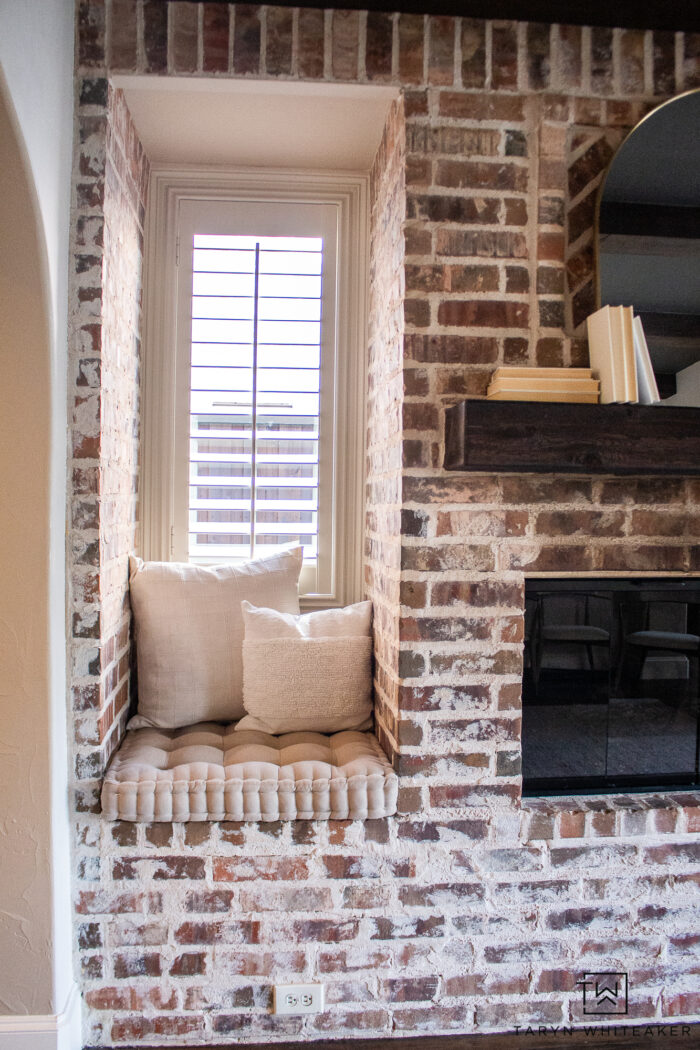 See the before and after of this Modern English Brick Fireplace decorated with soft neutrals and urbane bronze ceiling for a modern look.