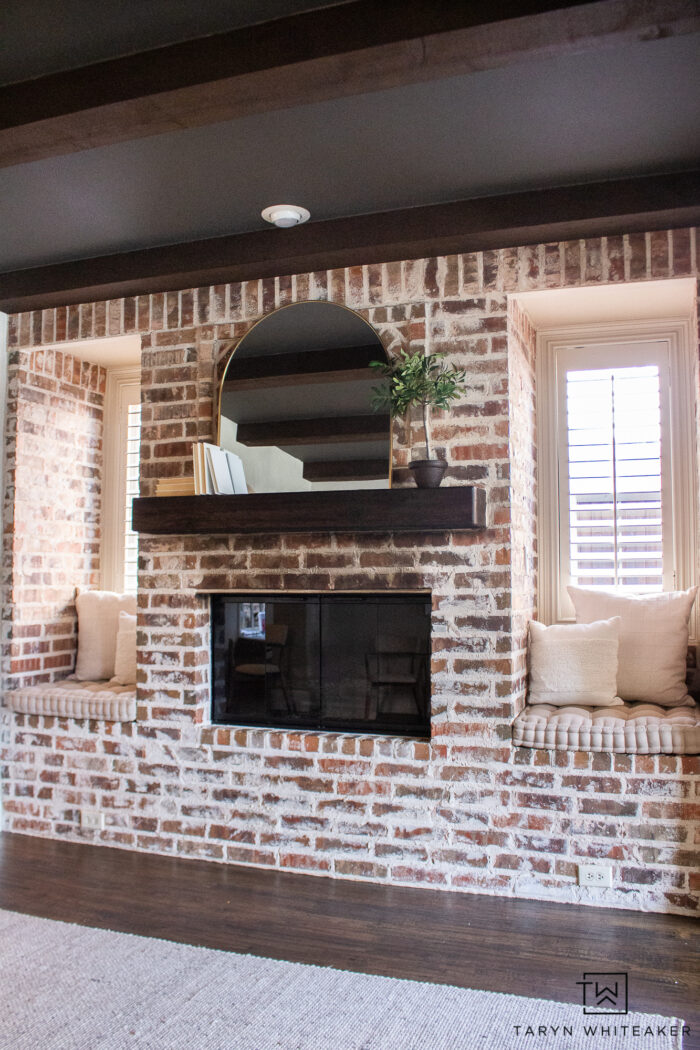 See the before and after of this Modern English Brick Fireplace decorated with soft neutrals and urbane bronze ceiling for a modern look.