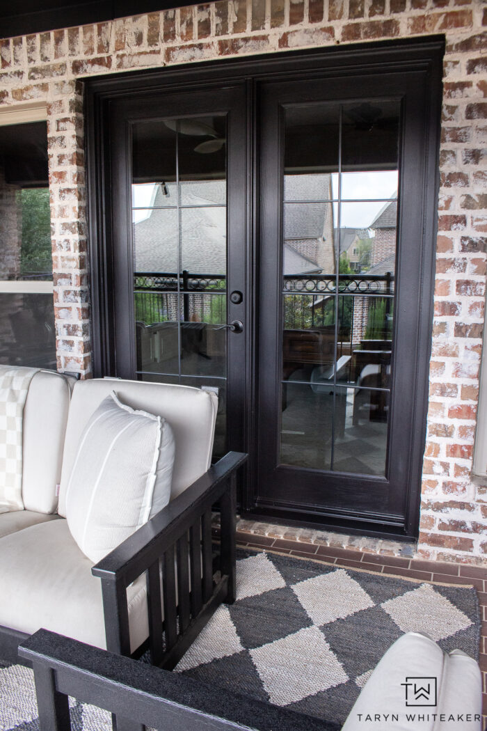 DIY French door makeover with Sherwin Williams Black Magic paint and adhesive window panes! Quick way to update your doors!