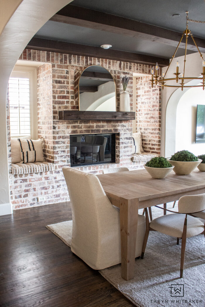 Modern English Country dining room with german schmear brick fireplace. 