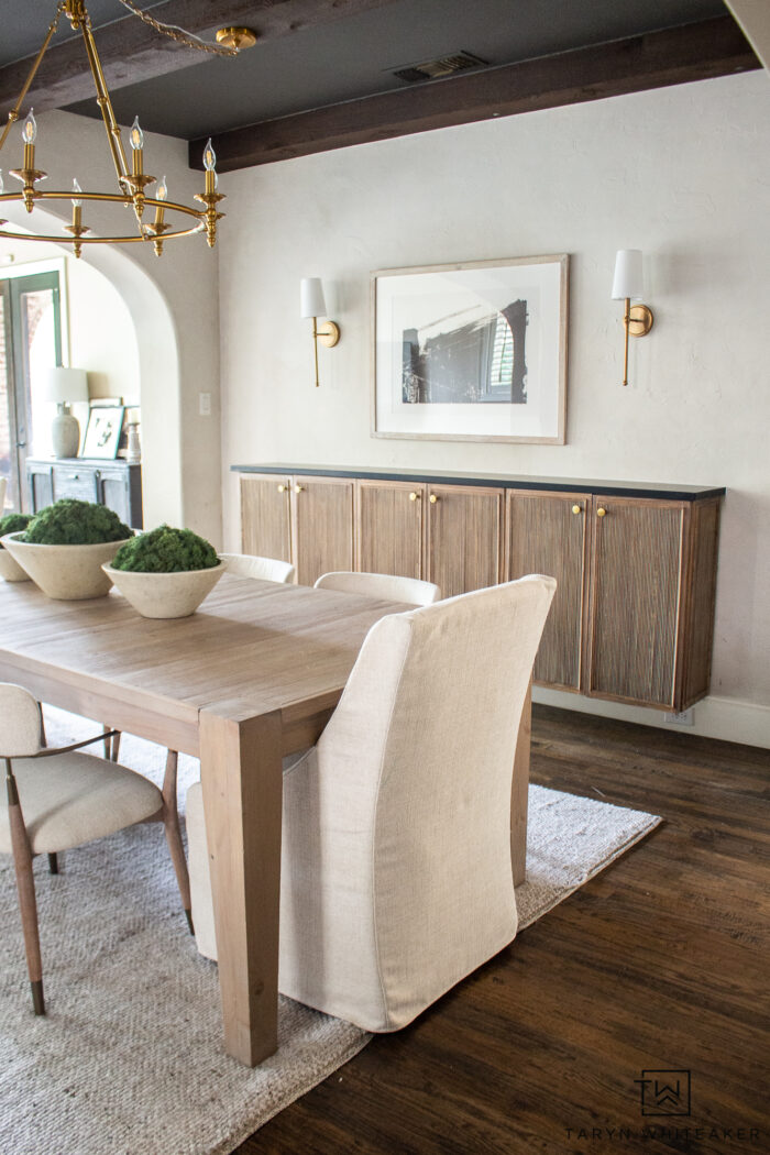 Tour this Modern Transitional Dining Room Decor combing lots of textures and natural elements, dark wood beams and gold accents. All sources available! 