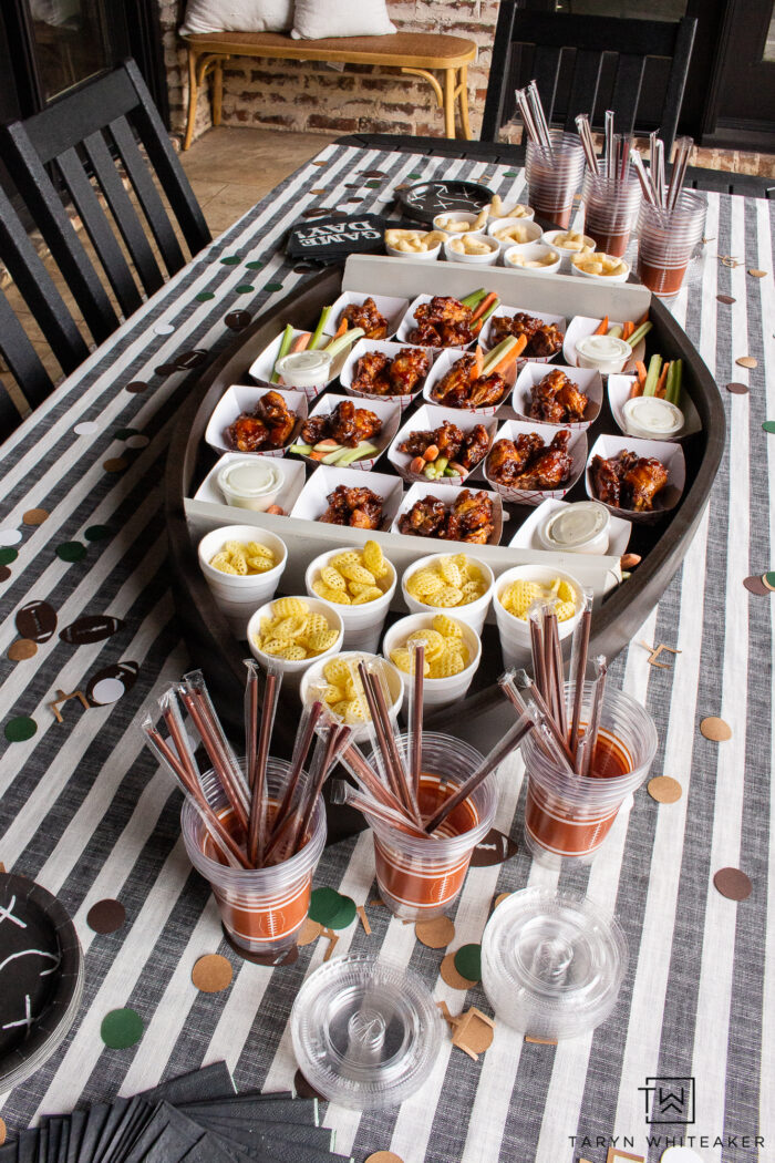 Learn how to make your own DIY Football Party Tray out of plywood and other DIY supplies! This large scale football tray will be a hit!