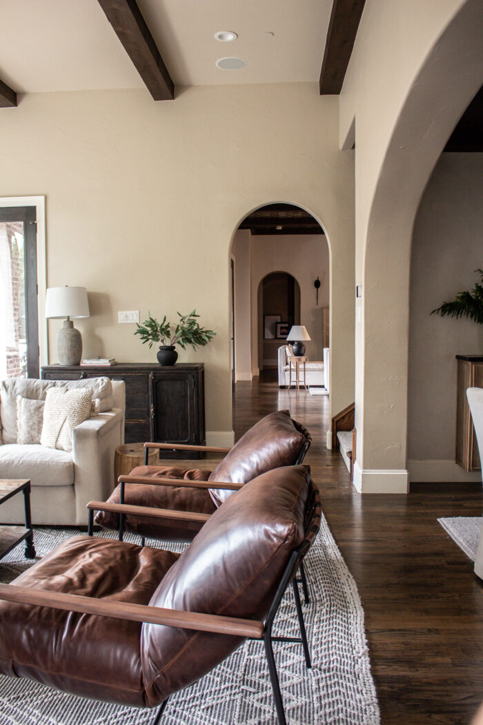 Organic modern family room design with casual elegance. Deep rich browns and neutral colors and texture.