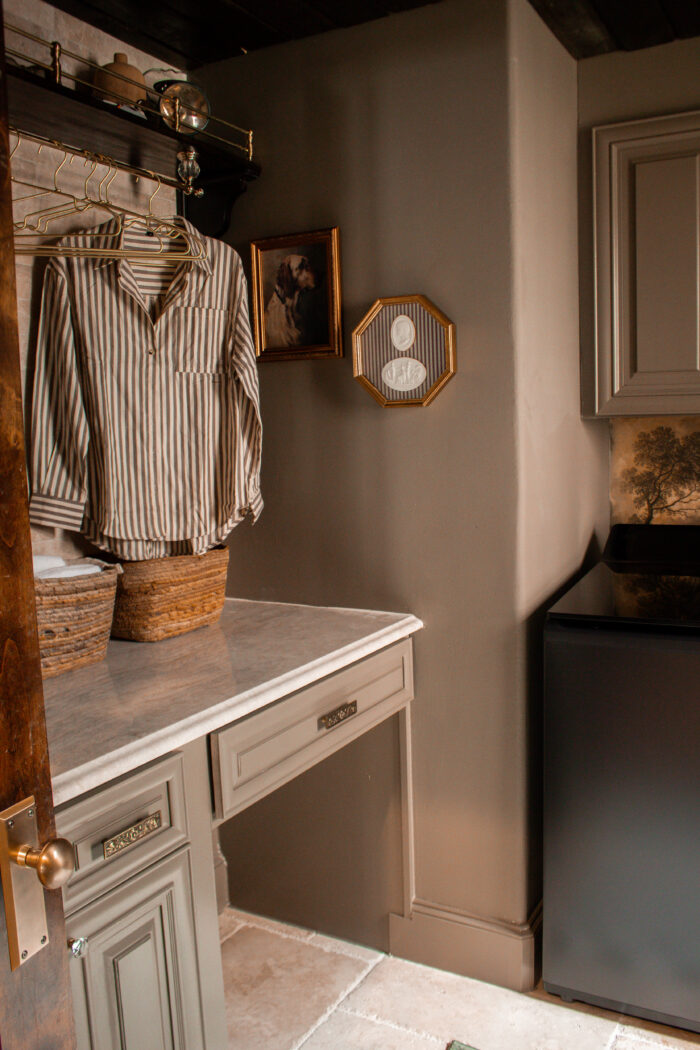Moody vintage laundry room makeover using BM Cromwall Gray color drench with antique and gold accents. 