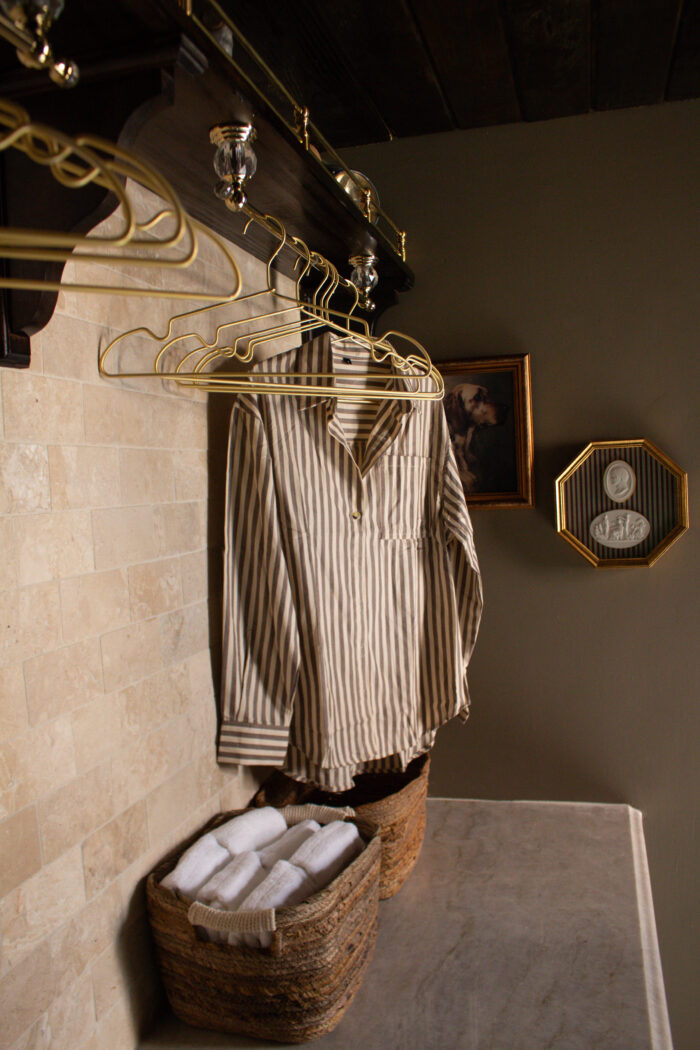 Moody vintage laundry room makeover using BM Cromwall Gray color drench with antique and gold accents. 