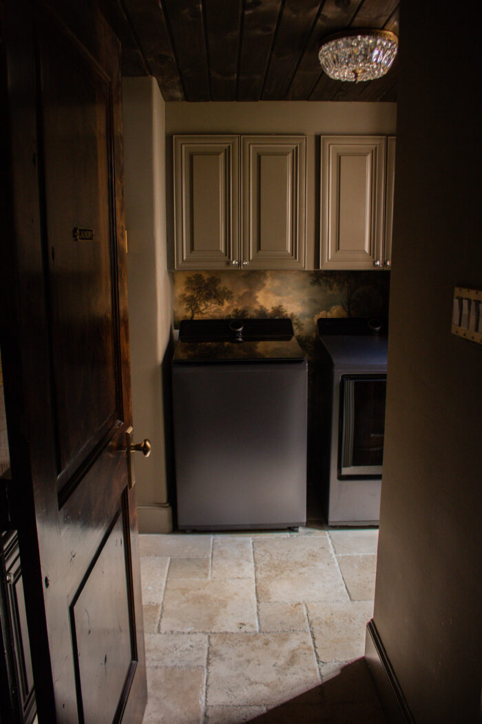 Moody vintage laundry room makeover using BM Cromwall Gray color drench with antique and gold accents. 