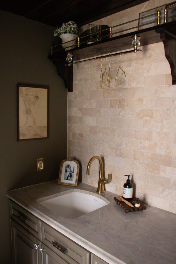 Moody vintage laundry room makeover using BM Cromwall Gray color drench with antique and gold accents. 