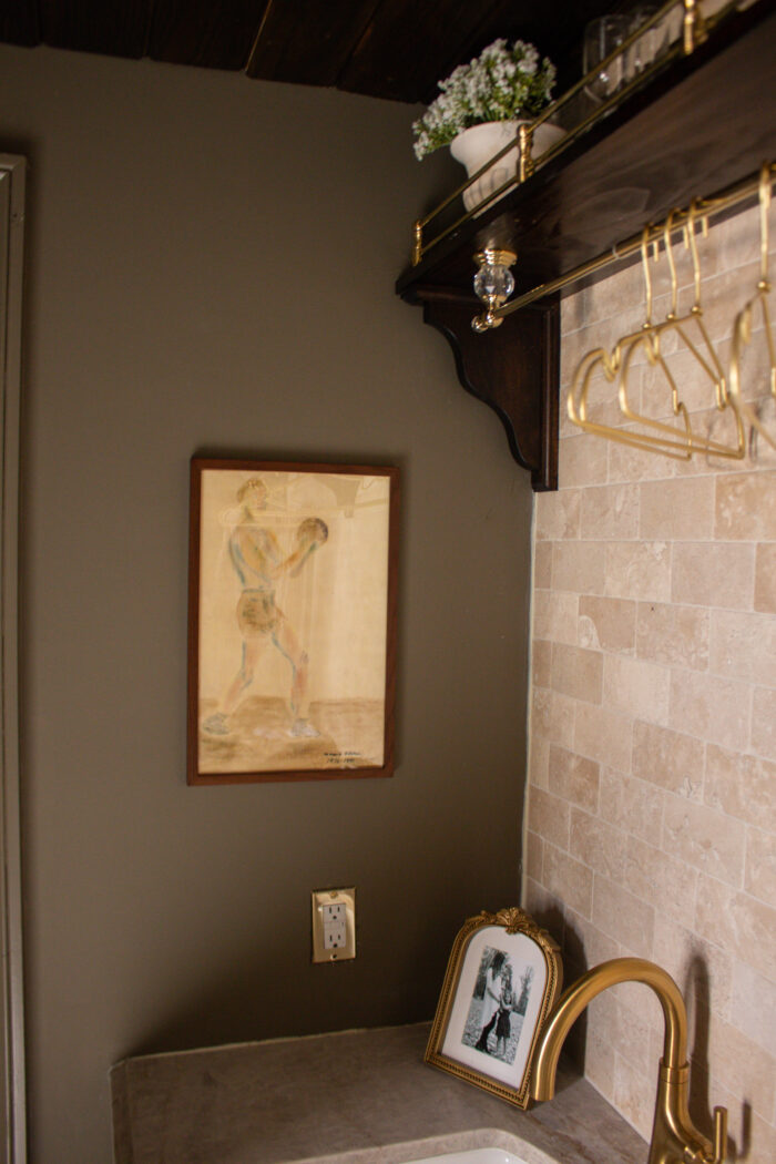 Moody vintage laundry room makeover using BM Cromwall Gray color drench with antique and gold accents. 
