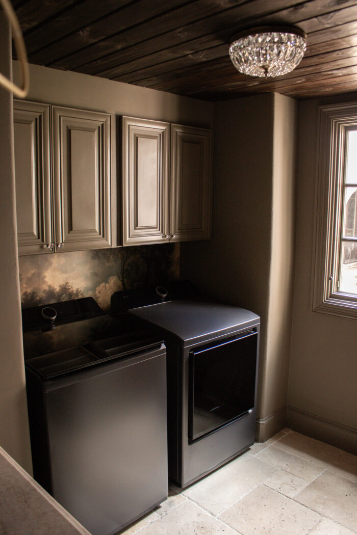 Moody vintage laundry room makeover using BM Cromwall Gray color drench with antique and gold accents. 