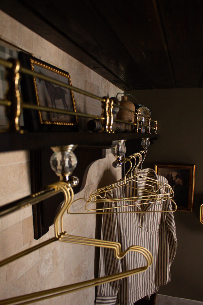 Moody vintage laundry room makeover using BM Cromwall Gray color drench with antique and gold accents. 